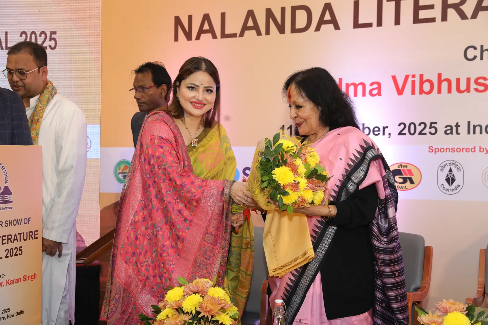 Ms. D. Aaliya receiving flowers at the Nalanda Literature Festival 2025 curtain raiser